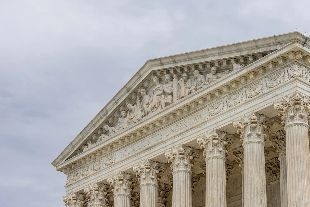 Supreme court of the United States of America in Washington DC Equality Justice under law with blue cloudy sky